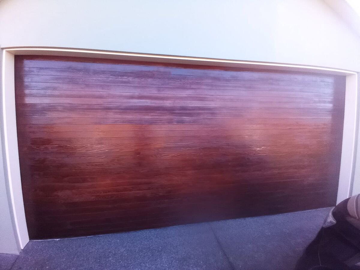 Wood garage door after staining