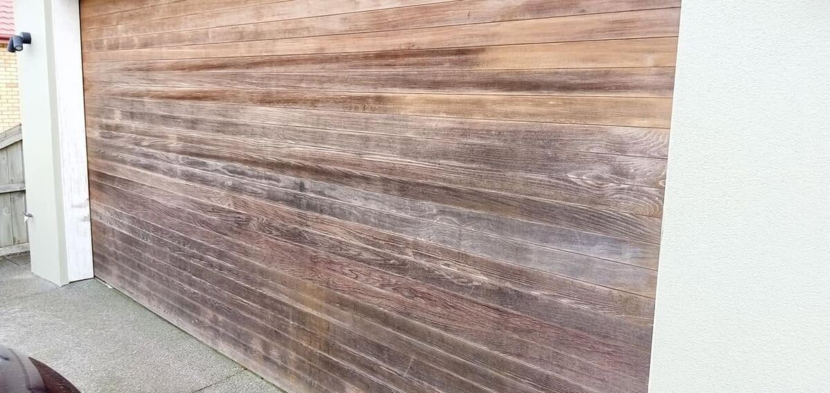 Wood garage door before staining